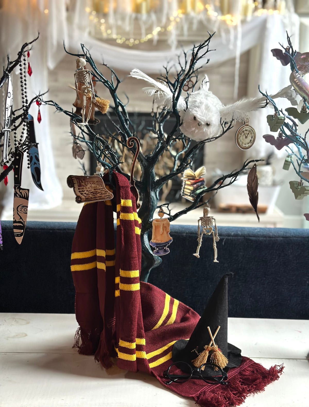 Wizard-themed tabletop tree with a striped scarf, owl, and tiny broom